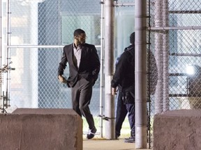 In this January 2017 photo, Isaiah McCoy, walks out of Howard R. Young Correctional Institution in Wilmington, Del., as a free man. McCoy enjoyed the limelight that came with sharing his story after he left Delaware's death row a free and exonerated man. He gave speeches to innocence projects, anti-death penalty groups and lawyers associations. Now, he's in a federal detention center in Honolulu, where prosecutors accuse him of sex trafficking. They say McCoy forced young women into prostitution.
