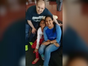 Joshua Holt poses for a photo with his wife Thamara and her daughter, at the airport in Caracas, Venezuela, Saturday, May 26, 2018.  Jailed in Venezuela on weapons charges nearly two years ago, Holt was released Saturday after a U.S. senator pressed for his freedom in a surprise meeting with President Nicolas Maduro.