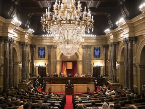 Separatist lawmaker Quim Torra, candidate for regional president, speaks during a parliamentary session in Barcelona, Spain, Saturday, May 12, 2018. The Catalan parliament said Friday that separatist lawmaker Quim Torra is set to be put forward for election in a vote Saturday. Separatist parties in Catalonia aim to elect one of their own as regional president by early next week, ending five months of political deadlock amid the restive region's attempts to secede from Spain.