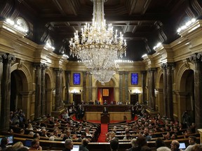 Separatist lawmaker Quim Torra, candidate for regional president, speaks during a parliamentary vote in Barcelona, Spain, Monday, May 14, 2018. Catalonia's lawmakers are meeting to end more than six months of leadership vacuum by voting in a fervent separatist as the new chief of the restive region, setting the scene for a new confrontation with Spain.