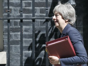 Britain's Prime Minister Theresa May leaves 10 Downing Street to attend the weekly Prime Ministers' Questions session, in parliament in London, Wednesday, May 9, 2018.