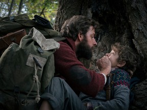John Krasinski, left, and Noah Jupe in a scene from "A Quiet Place."