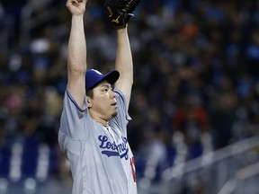 Los Angeles Dodgers' Kenta Maeda, of Japan, prepares to pitch during the first inning of a baseball game against the Miami Marlins, Thursday, May 17, 2018, in Miami.