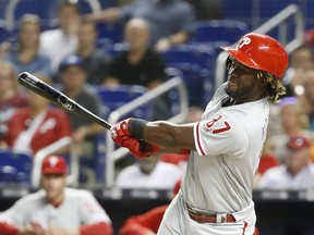 Philadelphia Phillies' Odubel Herrera hits a single during the first inning of a baseball game against the Miami Marlins, Monday, April 30, 2018, in Miami. Herrera reached base safely in his 30th consecutive game, the longest active streak in the majors. The Marlins defeated the Phillies 8-4.