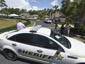 Walton County Sheriff's Office vehicles and crime scene tape block off a crime scene in Santa Rosa Beach, Fla., Tuesday, May 22, 2018, where Clinton Street, 30, was found dead in his home, in what authorities are calling a suspicious death.