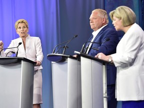 Ontario Liberal Leader Kathleen Wynne, left to right, Ontario Progressive Conservative Leader Doug Ford and Ontario NDP Leader Andrea Horwath participate during the third and final televised debate of the provincial election campaign in Toronto, Sunday, May 27, 2018.