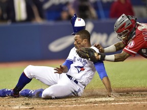 Toronto Blue Jays right fielder Curtis Granderson (18) is tagged out at home by Los Angeles Angels catcher Martin Maldonado during ninth inning American League baseball action in Toronto on Wednesday, May 23, 2018.