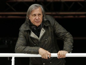FILE - In this Monday, May 23, 2016, file photo, former Romanian tennis player Ilie Nastase watches a match at the French Open tennis tournament in Paris, France. Romanian police have arrested former tennis player Ilie Nastase twice in the same day, first on suspicion of driving while drunk and refusing to take a breathalyzer test, and then for riding a scooter without a license.