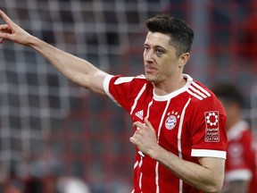 FILE - In this April 14, 2018 file photo Bayern's Robert Lewandowski celebrates after scoring his side's fifth goal during the German Bundesliga soccer match between FC Bayern Munich and Borussia Moenchengladbach in Munich, Germany.