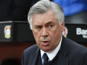 FILE - In this April 15, 2017 fiel photo Bayern head coach Carlo Ancelotti arrives to the German Bundesliga soccer match between Bayer Leverkusen and Bayern Munich in Leverkusen, Germany. Napoli's president has thanked coach Maurizio Sarri for his contributions after the Serie A club reportedly reached a deal to hire Carlo Ancelotti as his replacement. Napoli have not announced Sarri's departure, but a messaged posted on Twitter by president Aurelio De Laurentiis on Wednesday, May 23, 2018 and retweeted by the club's official account, seemed to confirm he is leaving.