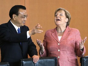 FILE - In this May 31, 2017 file photo German Chancellor Angela Merkel and China's Premier Li Keqiang joke prior to a meeting at the chancellery in Berlin, Germany.     German Chancellor Angela Merkel is heading to China with a business delegation on Wednesday afternoon.