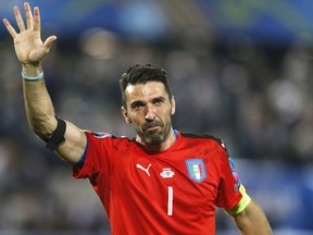 FILE - In this Saturday, July 2, 2016 file photo, Italy goalkeeper Gianluigi Buffon waves as he leaves the pitch after losing the Euro 2016 quarterfinal soccer match between Germany and Italy, at the Nouveau Stade in Bordeaux, France. Juventus captain Gianluigi Buffon has announced he is leaving the Italian club but the goalkeeper could continue playing elsewhere. Buffon, who is widely regarded as one of the best goalkeepers of all time, was expected to announce his retirement at a press conference at Allianz Stadium on Thursday, May 17, 2018.