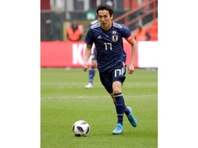 In this photo taken on Tuesday, March 27, 2018, Japan's Makoto Hasebe in action during an international friendly soccer match between Japan and Ukraine at Maurice Dufrasne Stadium in Liege, Belgium.