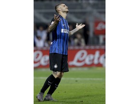 Inter Milan's Mauro Icardi reacts after scoring a goal that was disallowed, during the Serie A soccer match between Inter Milan and Sassuolo at the San Siro stadium in Milan, Italy, Saturday, May 12, 2018.