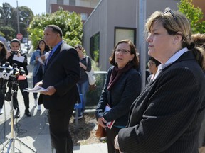 From right, San Francisco Sheriff Vicki Hennessy, hospital spokeswoman Rachael Kagan and Roland Pickens meet with reporters about a woman who was found dead in a stairwell of a power plant during a news conference outside Zuckerberg San Francisco General Hospital Thursday, May 31, 2018, in San Francisco, Calif. Officials say an elderly woman with dementia who was found dead in a stairwell of a power plant on a San Francisco hospital campus had checked herself out of a nearby care facility. San Francisco Sheriff Vicki Hennessy says Ruby Andersen left the care facility across the street from Zuckerberg San Francisco General Hospital on May 19 to visit her family. She was not a hospital patient.