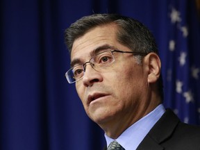 File - In this Feb. 20, 2018, file photo, California Attorney General Xavier Becerra speaks at a news conference in Sacramento, Calif. California's attorney general is asking an appeals court to quickly block a judge's decision to toss a 2016 state law allowing the terminally ill to end their lives. Becerra on Monday, May 21, 2018, requested an immediate stay and the reversal of a judge's ruling last week that the law was unconstitutionally approved by the state legislature.