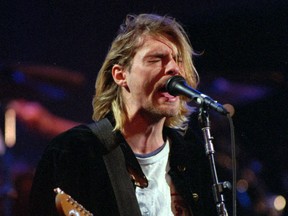 FILE - This Dec. 13, 1993 file photo shows Kurt Cobain of the band Nirvana performing in Seattle. The Washington State Court of Appeals has ruled that photographs from the scene of Nirvana frontman Cobain's death will not be released publicly. KING5-TV reports the court ruled Tuesday, May 15, 2018, that the photographs are exempt from Washington state's Public Records Act and releasing the photos would "violate the Cobain family's due process rights under the 14th Amendment."