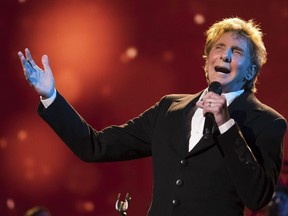 FILE - In this April 19, 2017 file photo, Barry Manilow performs at the world premiere of "Clive Davis: The Soundtrack of Our Lives" during the 2017 Tribeca Film Festival in New York. Manilow is returning to Las Vegas for a serious of regular shows starting in May at the Westgate Las Vegas Resort & Casino. Tickets for Manilow's 85-minute show celebrating his greatest hits such as "Mandy" and "Can't Smile Without You" go on sale Wednesday, May 2, 2018.