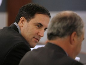 FILE  - In this Oct. 15, 2007, file photo, Darren Mack, left, talks to his lawyer Scott Freeman before jury selection in a Clark County courtroom in Las Vegas. Mack, the former wealthy owner of a Reno pawn shop is again appealing his murder conviction for killing his ex-wife and trying to assassinate the judge who handled their divorce 12 years ago.