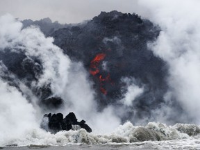 FILE  - In this May 20, 2018 file photo, lava flows into the ocean near Pahoa, Hawaii.