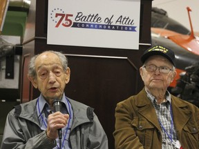 In this May 19, 2018, photo World War II veterans Allan Seroll, left, of Massachusetts, and William Roy Dover, right, of Alabama, right, attend a 75th anniversary celebration of the Battle of Attu in Anchorage, Alaska. Dover was an American soldier who took part in the May 1943 effort to reclaim Alaska's Attu Island from the Japanese. It was the only World War II battle fought on North American soil.