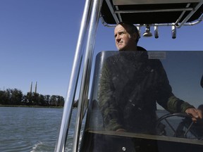 In this photo taken Monday, March 26, 2018, Karl Mayer, with the Monterey Bay Aquarium, pilots a boat while looking for sea otters along the Elkhorn Slough in Moss Landing, Calif. Along 300 miles of California coastline, including Elkhorn Slough, a wildlife-friendly pocket of tidal salt marsh and rich seagrass in the curve of Monterey Bay, southern sea otters under state and federal protection as a threatened species have rebounded from as few as 50 survivors in the 1930s to more than 3,000 today.