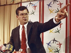 FILE - In this 1990 file photo, Billy Payne takes questions at an Olympic news conference on the city's bid to host the games in Atlanta. Payne led the bid to bring the Olympics to Atlanta in 1996. While his name doesn't roll off the tongue of the average fan, nothing more is needed to assure that William Porter Payne will go down as one of the most influential people in modern American sports.