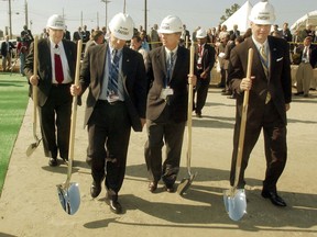 This phto taken Oct. 14, 2005, shows  from left to right, Ambassador Linton Brooks, administrator with the National Nuclear Security Administration, Sen. James DeMint, R-S.C., Sen. Lindsey Graham, R-S.C., and Reps. Gresham Barrett, R-S.C., head out to break ground for the Mixed Oxide Fuel Fabrication Facility at Savannah River Site in Jackson, S.C.  Energy Secretary Rick Perry has formally ended construction of a facility meant to reprocess weapons-grade plutonium into fuel for reactors, a key element in the nation's longstanding efforts to contain the global nuclear threat. Perry executed a waiver on Thursday, May10, 2018 to terminate construction of the Mixed Oxide Fuel Fabrication Facility at the Savannah River Site in South Carolina.