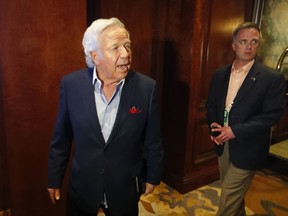 New England Patriots owner Robert Kraft, left, speaks to reporters as he enters the NFL owners spring meeting Tuesday, May 22, 2018, in Atlanta.