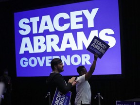 Supporters react during an election-night watch party for Georgia Democratic gubernatorial candidate Stacey Abrams, Tuesday, May 22, 2018, in Atlanta.