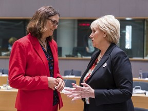 European Commissioner for Trade Cecilia Malmstrom, left, talks with Ireland's Business, Enterprise and Innovation Minister Heather Humphreys during an EU foreign affairs council on trade at the Europa building in Brussels on Tuesday, May 22, 2018.