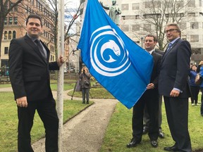 President of the Gaelic Council of Nova Scotia, David Rankin, left to right, minister of Gaelic Affairs of Nova Scotia Randy Delorey and MLA Hugh MacKay pose next to a Gaelic flag in Halifax, on Tuesday, May 1, 2018. Randy Delorey, minister of Gaelic Affairs of Nova Scotia, revealed the new Gaelic licence plate during an opening ceremony and flag raising to mark the 22nd annual Gaelic Nova Scotia Month on Tuesday. Like the Gaelic flag that was raised before dozens of people at Tuesday's ceremony, the plate also features a salmon – the symbol of shared wisdom.