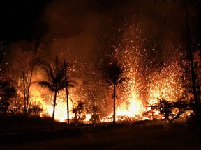 This image released by the US Geological Survey shows a volcanic fissure with  lava fountains as high as about 70 m (230 ft) in Leilani Estates, Hawaii, on May 5, 2018. The Kilauea Volcano, the most active in Hawaii, was highly unstable on May 6, 2018, as lava spouted into the air and fissures emitted deadly gases -- hazards that have forced thousands of people to evacuate