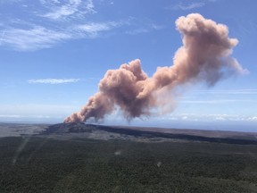 An ash plume rises above the Puu Oo vent, on Hawaii's Kilaueaa Volcano Thursday, May 3, 2018 in Hawaii Volcanoes National Park.