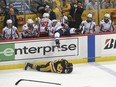 Washington Capitals winger Tom Wilson goes flying backwards into the bench after hitting Pittsburgh Penguins centre Zach Aston-Reese on May 1.