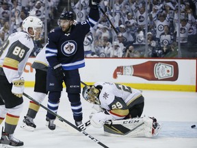Paul Stastny celebrates a goal by Jets teammate Mark Scheifele against Vegas Golden Knights netminder Marc-Andre Fleury as Nate Schmidt defends during Game 1 of the Western Conference final in Winnipeg on Saturday night.