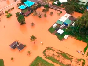 FILE - This April 15, 2018 image taken from video provided by the U.S. Coast Guard shows flooding along Kauai's Hanalei Bay, Hawaii. The Hawaii Emergency Management Agency said Wednesday, May 2, 2018 a preliminary assessment shows mid-April landslides and flooding affected 532 homes. The totals came from a Joint Preliminary Damage Assessment conducted by state, county and federal officials.