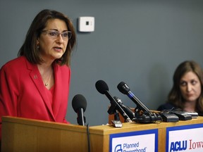 Planned Parenthood of the Heartland President and CEO Suzanna de Baca speaks during a news conference, Tuesday, May 15, 2018, in Des Moines, Iowa. Planned Parenthood and the American Civil Liberties Union said Tuesday that they had filed a lawsuit challenging the nation's most restrictive abortion law, an Iowa provision that bans most abortions once a fetal heartbeat is detected, around the sixth week of pregnancy.