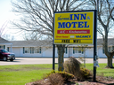 The Sherwood Inn and Motel in Charlottetown, P.E.I.. Two Charlottetown hoteliers have been charged with helping set up fake addresses for Chinese immigrants who entered the province under a business program that has been criticized for lax oversight.