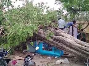 This frame grab from video provided by XYZ News shows damage caused by a rainstorm in the western Indian state of Rajasthan, Thursday, May 3, 2018.