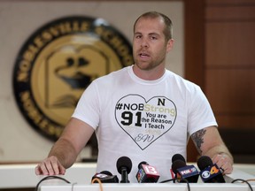 Jason Seaman, a seventh grade science teacher at Noblesville West Middle School in Noblesville, Ind., speaks to the media during a press conference Monday, May 28, 2018. Seaman tackled and disarmed a student with a gun at the school on Friday. He was shot but not seriously injured.