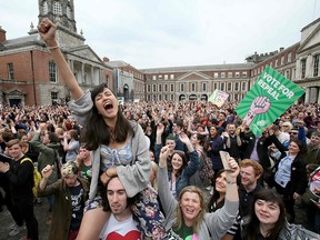 'Yes' campaigners celebrate the official result of the Irish abortion referendum at Dublin Castle on May 26, 2018, which showed a landslide decision in favour of repealing the constitutional ban on abortion.