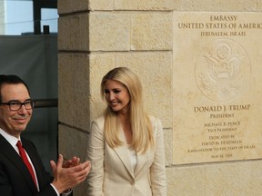 FILE - In this Monday, May 14, 2018 file photo, U.S. President Donald Trump's daughter Ivanka Trump, right, and U.S. Treasury Secretary Steve Mnuchin attend the opening ceremony of the new U.S. embassy in Jerusalem. Seventy years after Israel's founding, images of victory and violence showcased the contradictions that bedevil the Jewish state. Deadly protests flared along the Gaza border, where troops killed dozens of Palestinians even as politicians feted the new U.S. Embassy in Jerusalem as a symbol of the ironclad alliance with Washington.