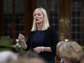 Minister of Environment and Climate Change Catherine McKenna rises during Question Period in the House of Commons on Parliament Hill in Ottawa on Tuesday, May 1, 2018.