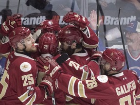 The Acadie-Bathurst Titan celebrate Noah Dobson's goal against the Regina Pats during first period Memorial Cup action in Regina on Sunday, May 20, 2018.