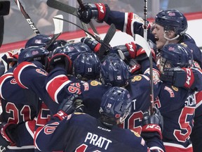 The Regina Pats celebrate their win over the Hamilton Bulldogs during the Memorial Cup semifinal action in Regina on Friday, May, 25, 2018.