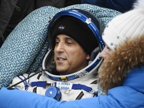 In this Feb. 28, 2018, file photo NASA astronaut Joe Acaba rests in a chair after landing in a remote area south-east of the Kazakh town of Zhezkazgan, Kazakhstan.
