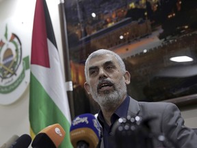 Yehiyeh Sinwar, the Hamas militant group's leader in the Gaza Strip, speaks to foreign correspondents, in his office in Gaza City, Thursday, May 10, 2018. Sinwar said Thursday that protesters in a mass demonstration along the Israeli border next week will be unarmed and peaceful, but also compared them to a "starving tiger" and held out the possibility that tens of thousands of people could burst through the fence and swarm into Israel.