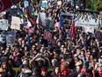 Anti-pipeline protesters march in Burnaby, B.C., on March 10, 2018.