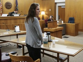 FILE - In this May 16, 2018, file photo, Emily Glass appears in Sedgwick County District Court in Wichita, Kan. Glass, the stepmother of a 5-year-old Wichita boy who has been missing since February, was found not guilty Wednesday of child endangerment in an unrelated case involving her own daughter. Glass was booked into jail Thursday evening, May 24, 2018, on suspicion of interfering with a law enforcement officer and obstruction after a body was found under a bridge on a gravel road in Harvey County. Authorities have not released any information on the remains.